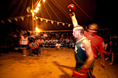 Meatman beats up challenger, boxing event, Fred Brophy's Boxing Troupe, Queensland, Australia
