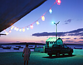 Chain of lights at a bar at harbour in the evening, Sal Rei, Boavista, Cape Verde, Africa