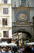 People beneath clock tower, Rue du Gros Horloge, Rouen, Normandy, France, Europe