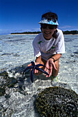 Woman with Blue Starfish, Heron Island, Queensland, Australia