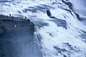 People at Godafoss Waterfall, Skjalfandafljo River, Near Akureyri, Iceland