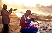 Two men playing the trumpet at a promenade, Malecon, Havana, Cuba