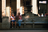 Older couple relaxing, Prado Havana, Cuba