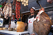 Salesmen at a market stand, Porto Azzurro, Isle of Elba, Tuscany, Italy, Europe