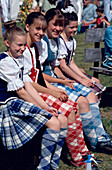 Highland Fling Dancers, gilrs on a bench, Glenfinnan Highland Games, Invernesshire, Scotland, Great Britain, Europe