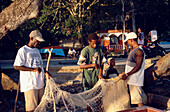 Fishermen, Fishernet, Samana Peninsula, Fishermen in Cacaos handling a net in front of the beach, Dominican Republic