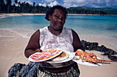 Woman, Lobster, Beach, Woman offers lobster in a beach bar at Playa Rincon, Las Galeras, Samana Peninsula, Dominican Republic