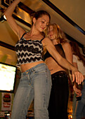 Girls dancing on the bar, Lacgecko Bar, Duval Street Key West, Florida, USA