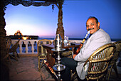 Hookah smoker, Felfella, egyptian restaurant, Hurghada, Red Sea, Egypt