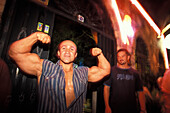 Man showing his muscles, disqotheque in Marmaris, Marmaris, Turkey