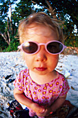 Toddler, girl on the beach with sunglasses, Anse la Mouche, Mahe, Seychelles, Indian Ocean