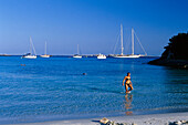 Woman at the beach Plage de Piantarella, south coast near Bonifacio, Corsica, France