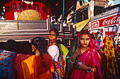Pilgrims with leaves , god Krishna, Ratha-Yathra feast , Varanasi, Benares Uttar Pradesh, India