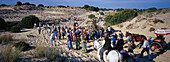 Pilgrims crossing the Donana National Park afoot and on horseback, Andalusia, Spain