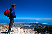 Woman on mountain top of Teide 3718 m, , Parque Nacional del Teide, Tenerife, Canary Islands, Spain