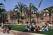 People enjoying a picnic in parc de la Mar, Palma, Mallorca, Spain
