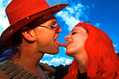 Youn couple doing french kiss, Loveparade, Berlin, Germany