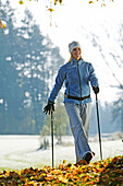 Young woman Nordic Walking, Nordic Walking, Herbst, Young Woman, Nordic Walking, Voralpenland, Germany, Junge Frau, Nordic Walking, Herbst, Voralpenland Oberambach am Starnberger See, 2005