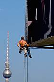 Industrial climber, television tower, berlin, germany