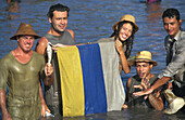 Young people showing their flag, the Pond Holiday, El Charco, San Nicolas de Tolentino, Gran Canaria, Canary Islands, Spain