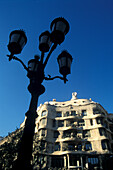 Street lamp and Casa Mila under blue sky, Passeig de Gracia, Barcelona, Spain, Europe