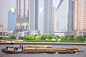 View at freighter on the Huangpu river and high rise buildings, Shanghai, China, Asia