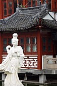Statue in front of a traditional house, Shanghai, China, Asia