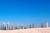 Sand of the desert and Dubai skyline under blue sky, Dubai, UAE, United Arab Emirates, Middle East, Asia