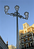 Street lamp in front of buildings and blue sky, Madrid, Spain, Europe