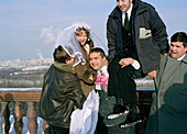 Friends making a joke with bride, Marriage, Sparrow Hills, Moscow, Russia