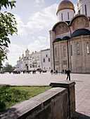 People crossing the Cathedral Square in the Kremlin, Moscow, Russia
