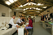 People drinking and eating at fashion shop, Superette, cafe and clothes, Fashion shop near Victoria markets, Auckland, North Island, New Zealand