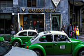 VW Beetle taxis in a street, Mexico, America