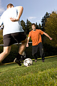 Young men playing soccer