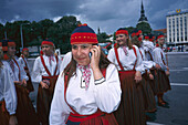 Girls with traditional costume and handy, Tallinn Estonia