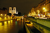 Notre Dame and the river Seine at night, Paris, France, Europe
