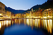 Illuminated restaurants at harbour in the evening, Portofino, Liguria, Italy, Europe