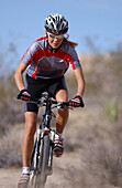 Woman on a mountainbike tour, Gooseberry Trail, Zion National Park, Springdale, Utah, USA