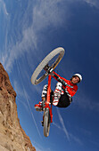 Man on a mountain bike doing a jump, Gooseberry Trail, Zion National Park, Springdale, Utah, USA
