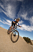 Woman on a mountainbike tour, Gooseberry Trail, Zion National Park, Springdale, Utah, USA