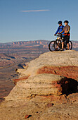 Couple on a mountainbike tour, admiring the view, Gooseberry Trail, Zion National Park, Springdale, Utah, USA