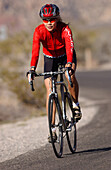 Woman on a racing bike in Zion National Park, Springdale, Utah, USA