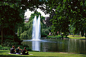 Warmer Damm, people in front of a pond at the park at Wilhelmstrasse, Wiesbaden, Hesse, Germany, Europe