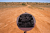 Sign in the Simpson Desert, Australia, Sign from the Pink Roadhouse at Oodnadatta to assist travellers crossing the remote Simpson Desert
