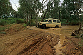 Four-wheel drive river crossing on the way to Mount Dare and the start of the Simpson Desert Crossing, Quensland, Australia