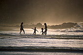 Sandy beach near Black Rock, Women with children, north coast of Tobago, West Indies, Caribbean
