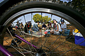 Bicycle tour, tourists, Burma, Fahrradtour, Touristen in Burma, Blick durchs Rad, view through bike wheel