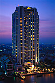 Hotel Peninsula at a river in the evening, Bangkok, Thailand, Asia