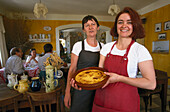 Waitress with quiche, restaurant, St. Jurs, Provence, France