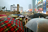Crowded square in rain, Tokyo, Japan